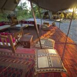 Lounge area depicting carpets of Middle Eastern influence at Selinda Explorers Camp