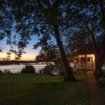 Dusk falls over the beautiful gardens at The River Club