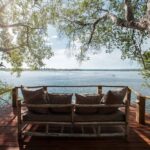 Relax on your private deck at the Tongabezi river cottages