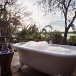 The bathtub on deck at Tongabezi's Birdhouse room