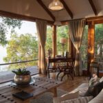 The deck from the Dog House at Tongabezi overlooks the river