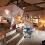 The spacious Moroccan style bedroom inside the Nuthouse at Tongabezi