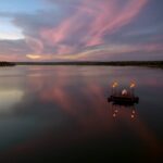 The iconic private dining Sanpan floating on the Zambezi at Tongabezi