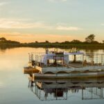 Private dinner on the barge at sunset at Xugana Island Lodge