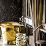 Freestanding golden bath tub in guest room at Little Mombo