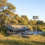 Complete view of Gomoti Plains Camp and fire pit area