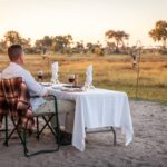 Private romantic bush dinner table at Gomoti Plains