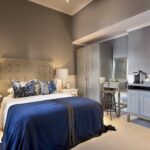 The bedroom interior of a single classic room at Cape Cadogan