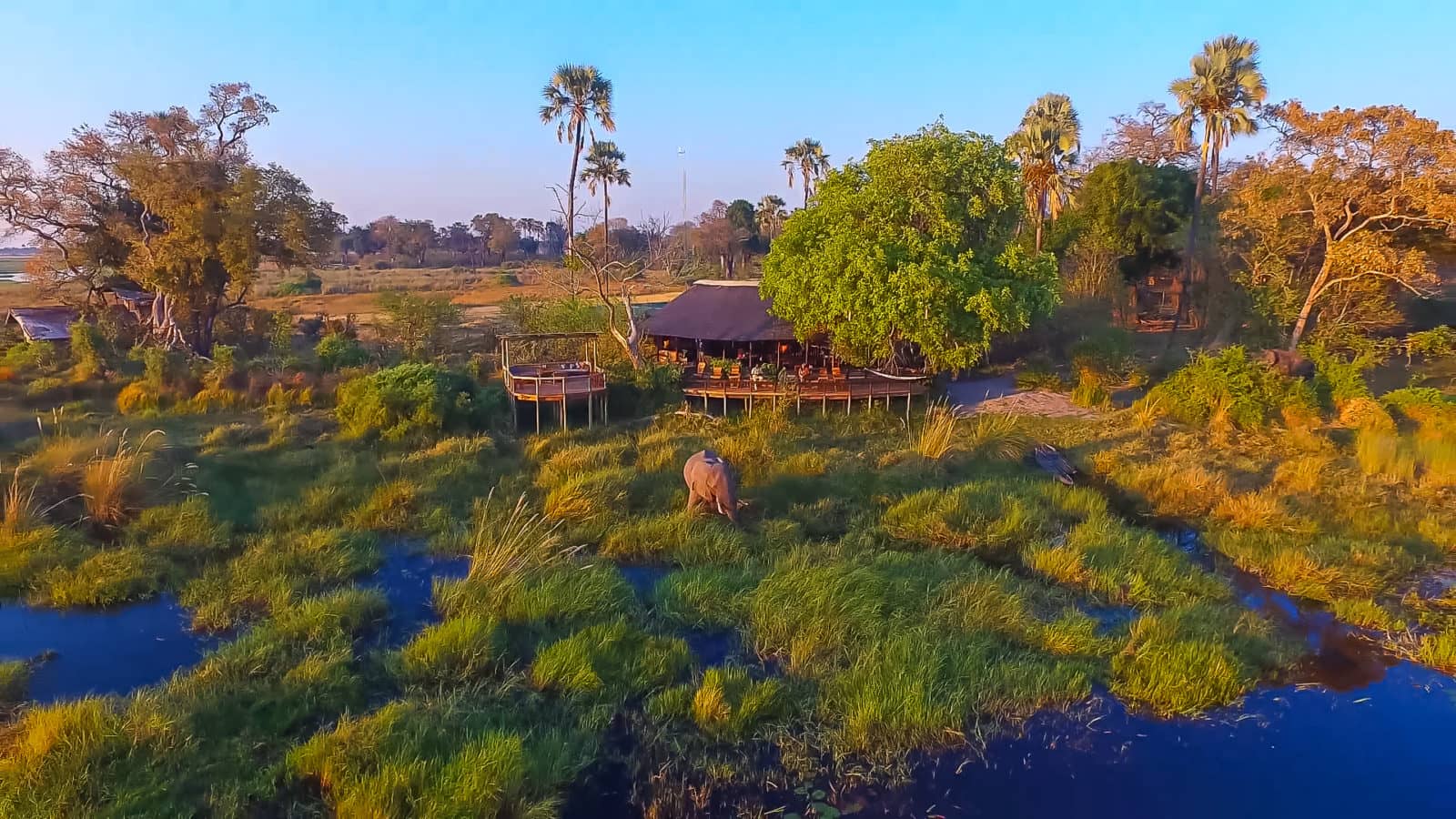 Aerial view of Delta Camp surrounded by the waters of the Okavango