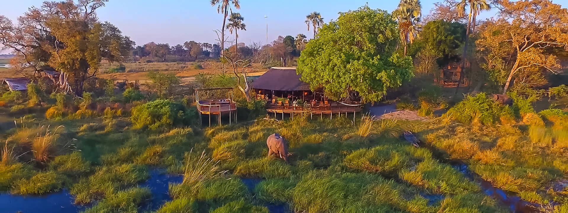 Aerial view of Delta Camp surrounded by the waters of the Okavango