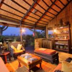 Delta Camp's lounge area at night has views over surrounding landscape