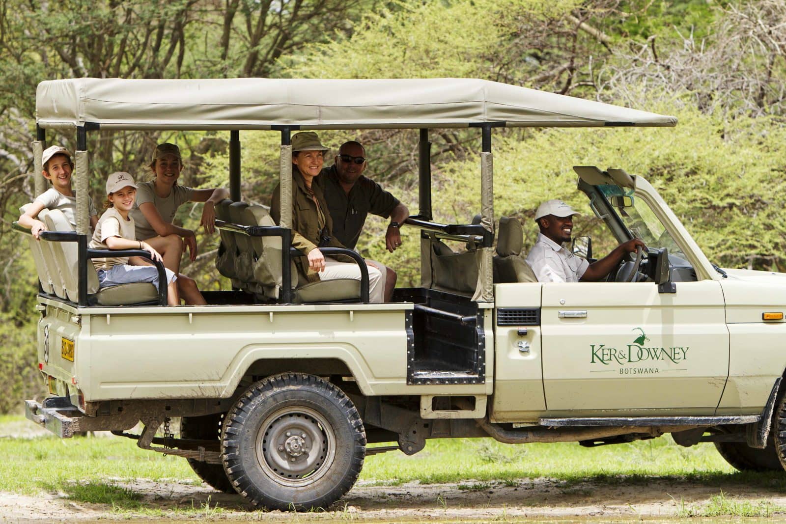 A guided game drive vehicles departs camp for a new adventure in the bush