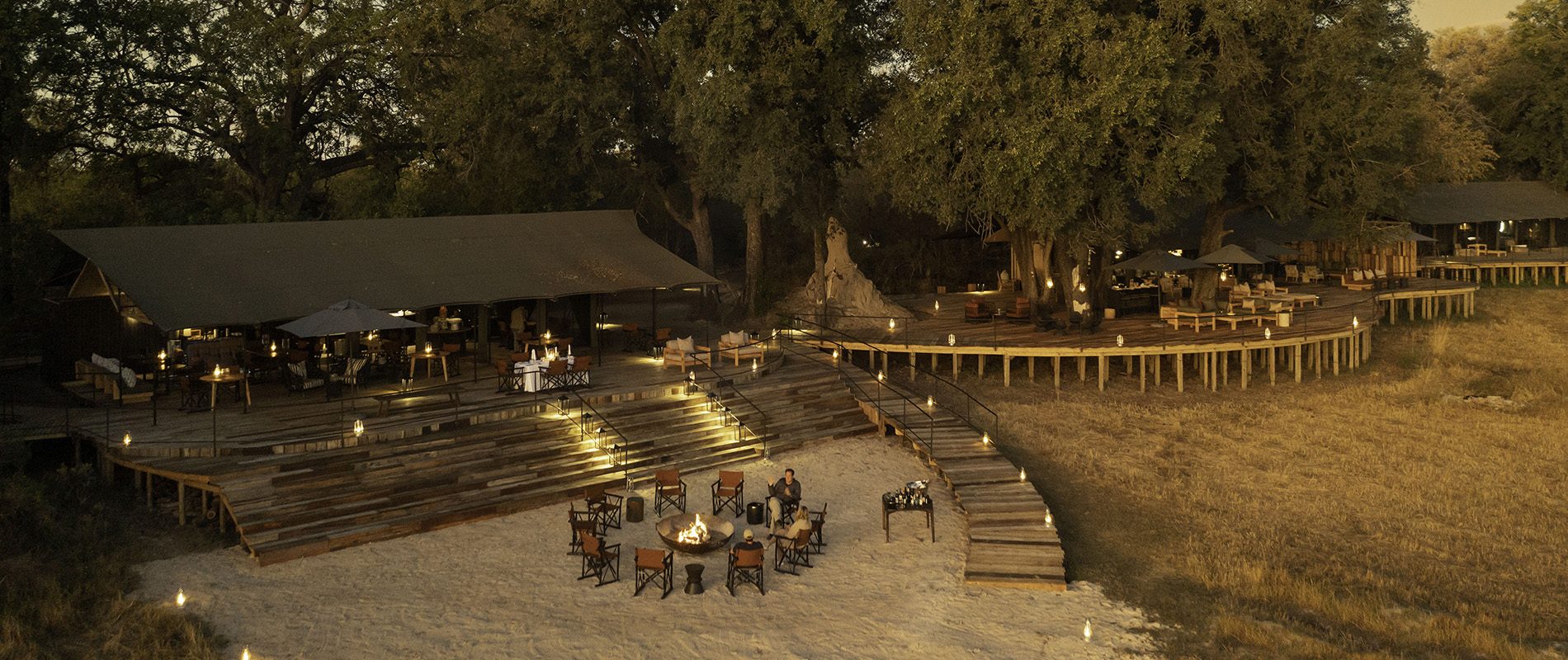 Aerial view of kiri camp at dusk with the fire lit