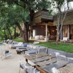 View of fire pit and swimming pool at Matetsi River Lodge