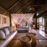 Large suite of Okavango Delta Safaris with lounge area and views on the the river.