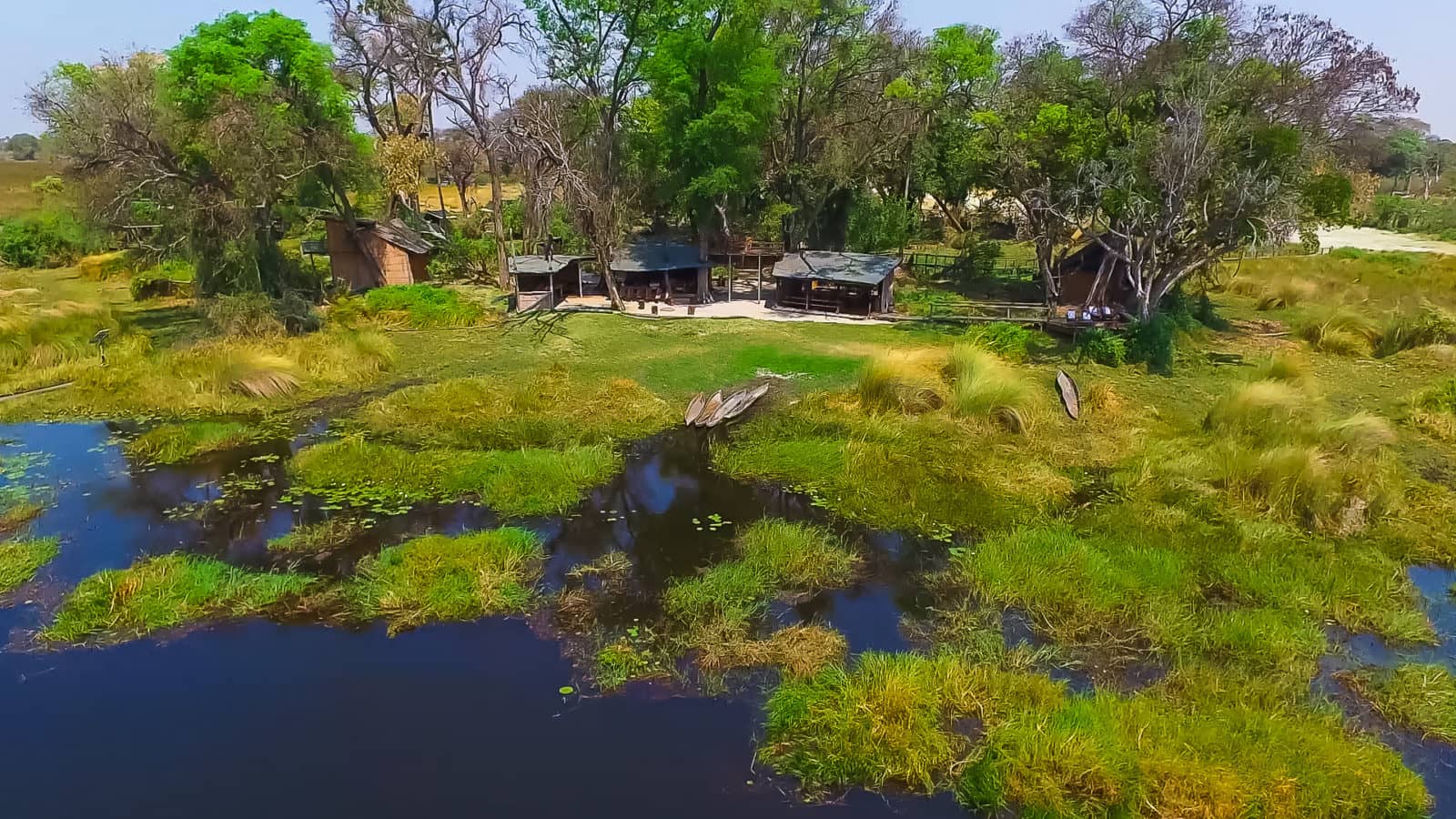 Aerial view of Oddballs Camp surrounded by Okavango Delta waters