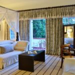 Victoria Falls' honeymoon suites boast four poster beds and extensive balconies