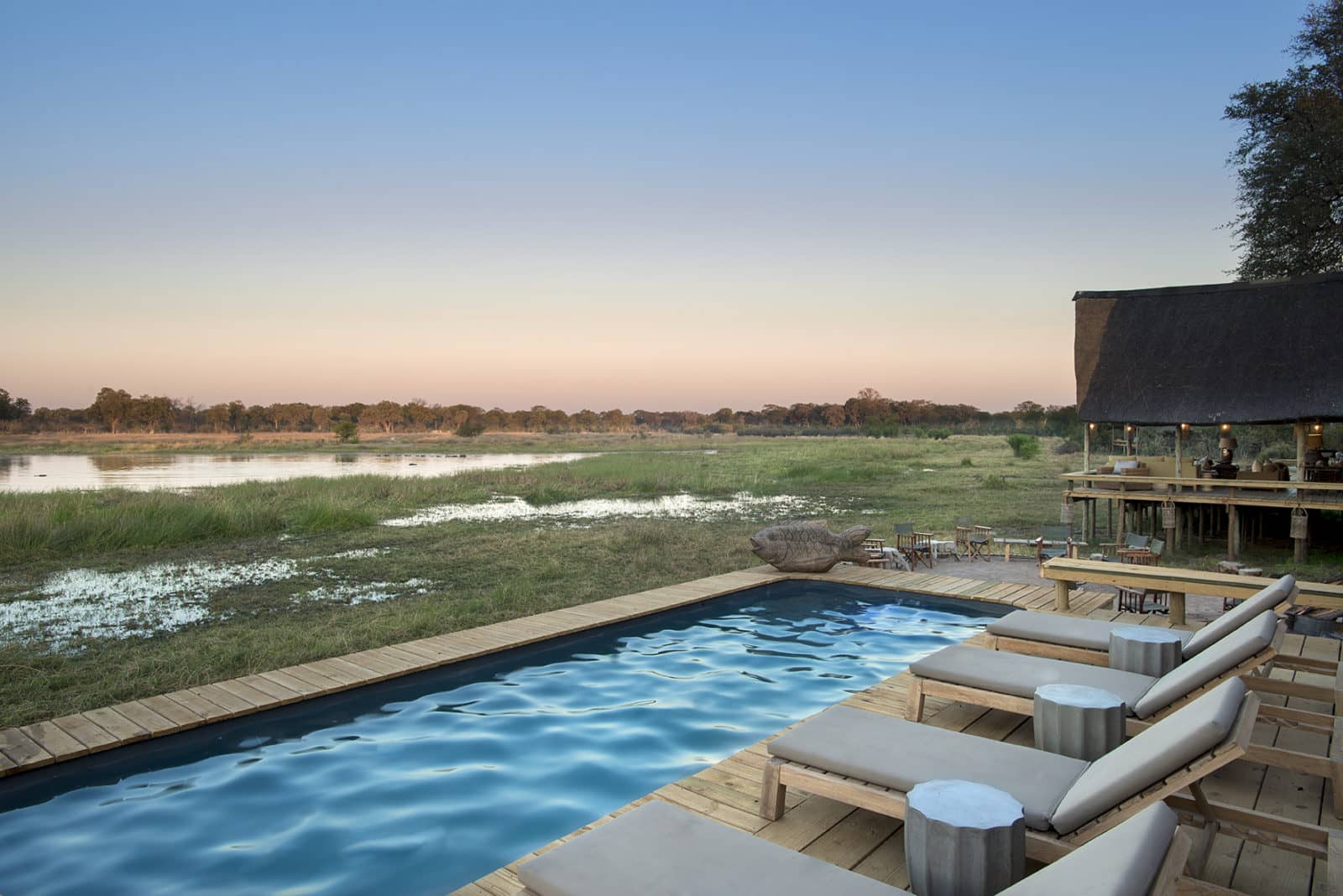 The sparkling pool and sundowners at Sable Valley Lodge