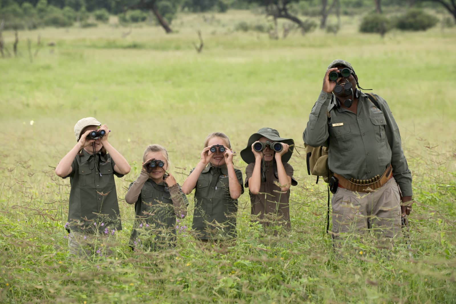 Youngsters on a game viewing expedition with guide from Thorntree River Lodge