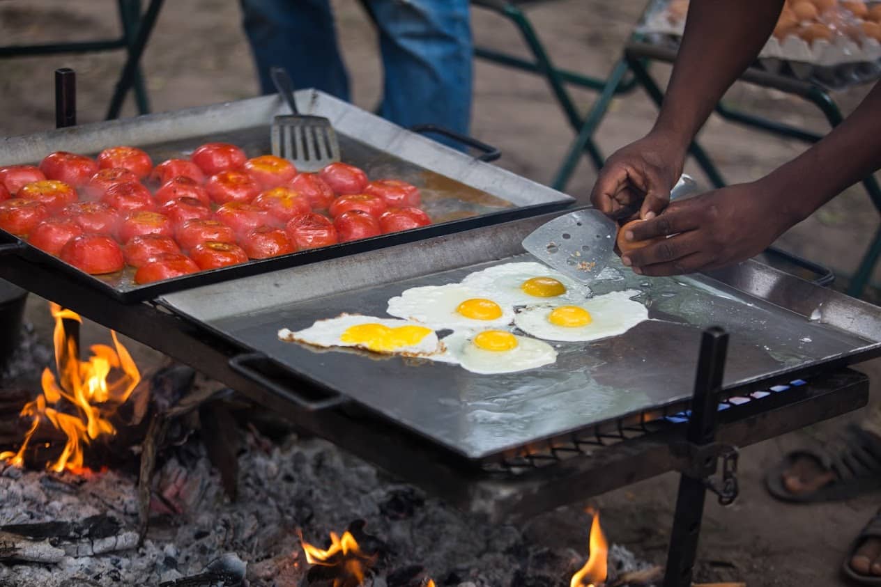 Freshly prepared breakfast over the fire while on safari with Bushways