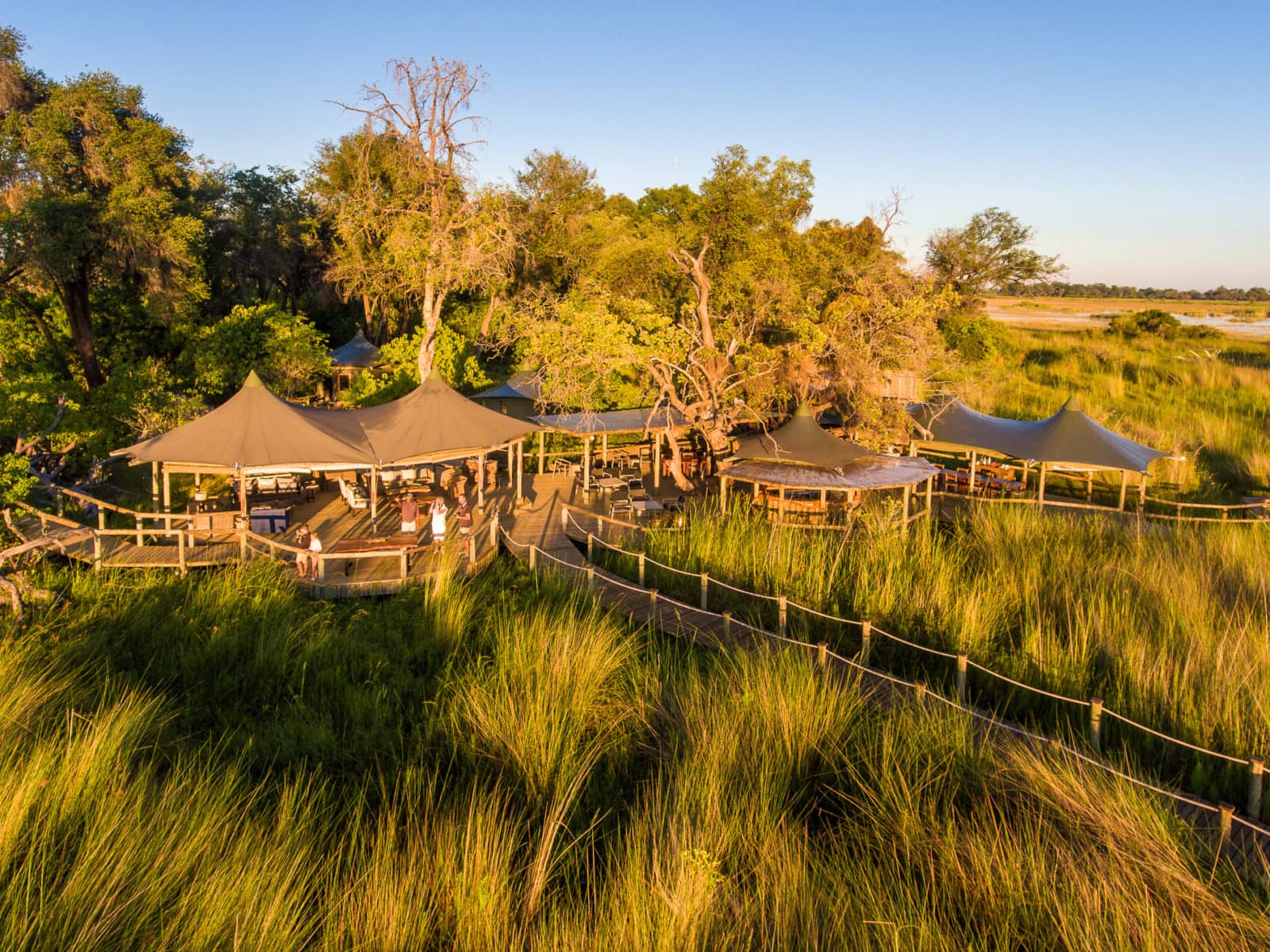 The scenic Little Vumbura Camp is located on an island and surrounded by water