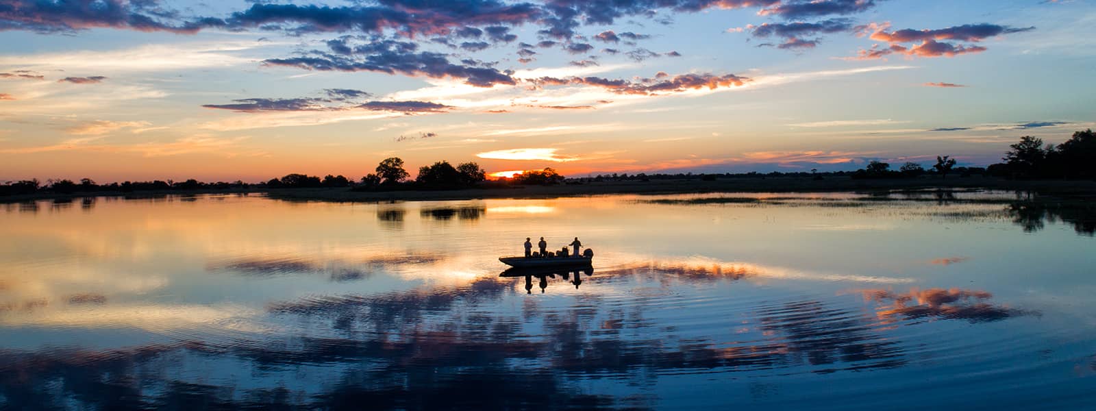 Sunset boating at Duke's Camp