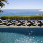 The Twelve Apostles 'inviting swimming pool deck with sun loungers