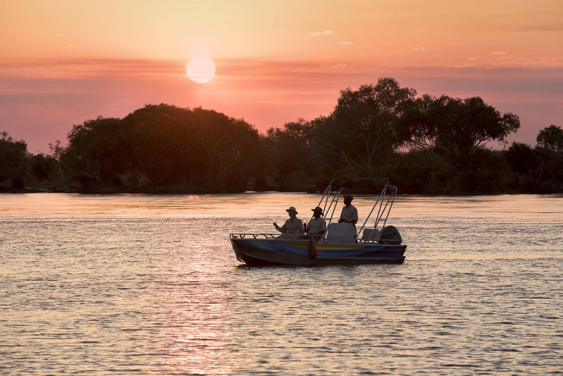 Fishing boat from Thorntree River Lodge at sunset on the Zambezi