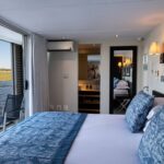 Interior decor of standard en suite cabin aboard the Zambezi Queen