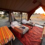 The rooms are light and airy, canvas flaps roll down at night