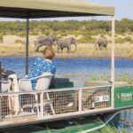Ngoma Safari Lodge boat cruise with elephants on river edge