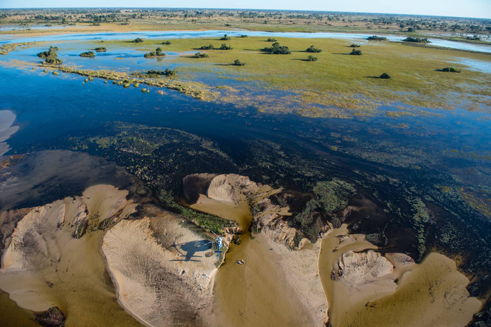 Formation of the Okavango Delta includes _sandbanks and floodplains
