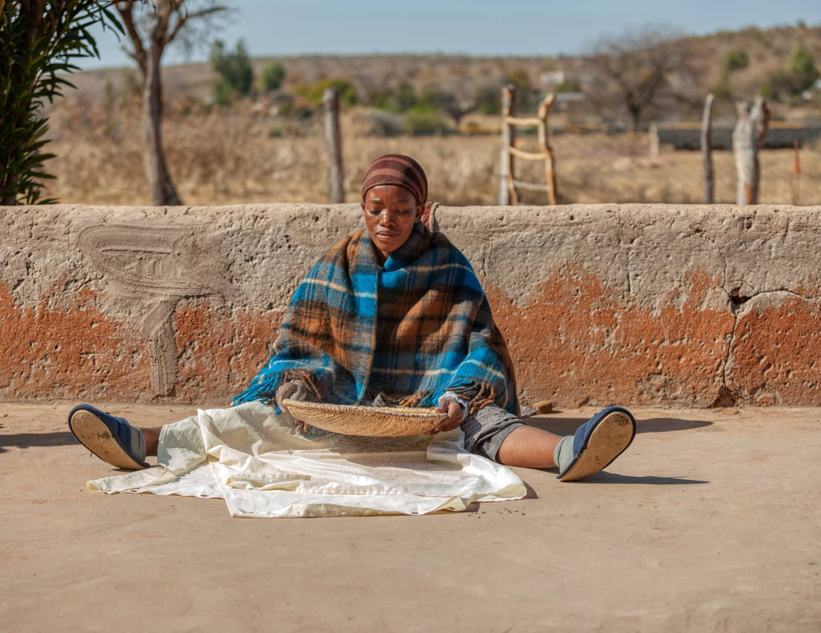 traditional Sorghum grinding in a rural botwana village