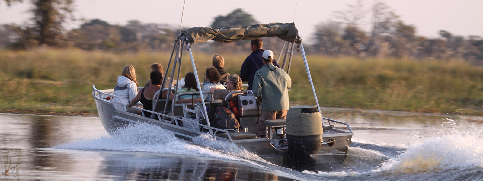 Endeavour Safaris guests explore the waterways of Chao Island on a boating safari