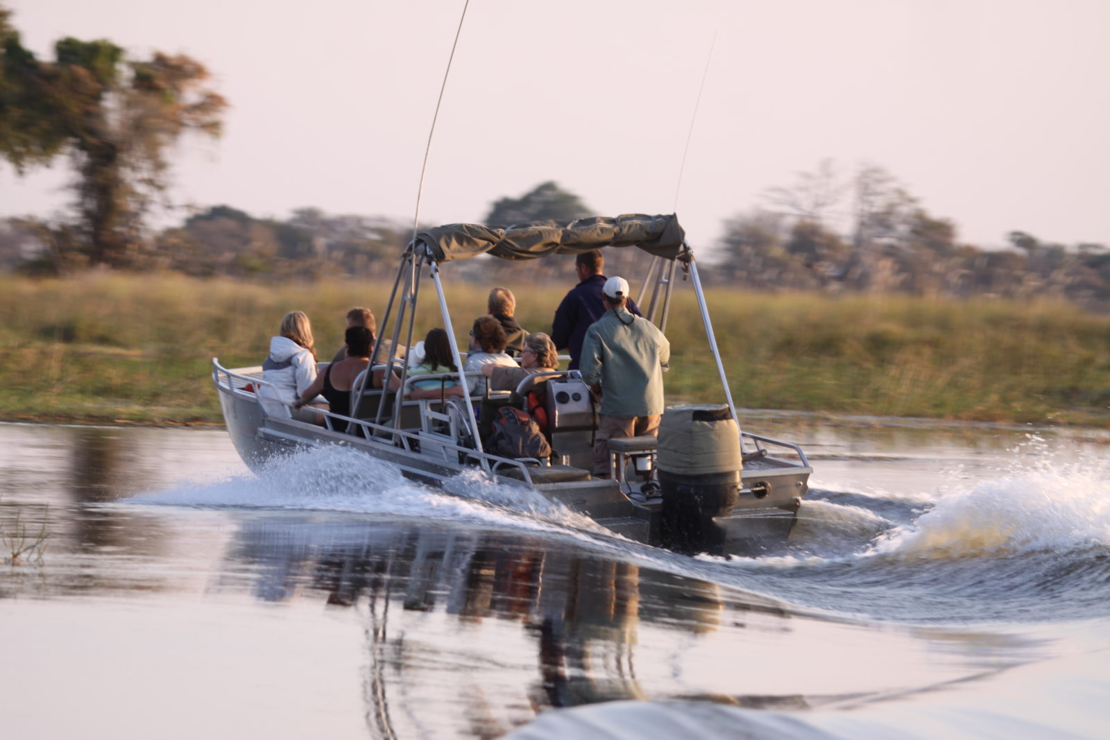 Boat safari departs camp with Endeavour Safaris guests onboard