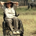 A guest with Endeavour Safaris enjoying watching elephant on safari