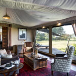 The spacious and elegant lounge area of the Duba Plains Suite