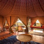 The graceful mess tent frames views of the Okavango at Duke's Camp