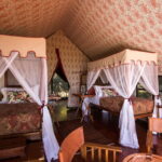The twin bedded rooms at Duke's Camp feature four poster beds