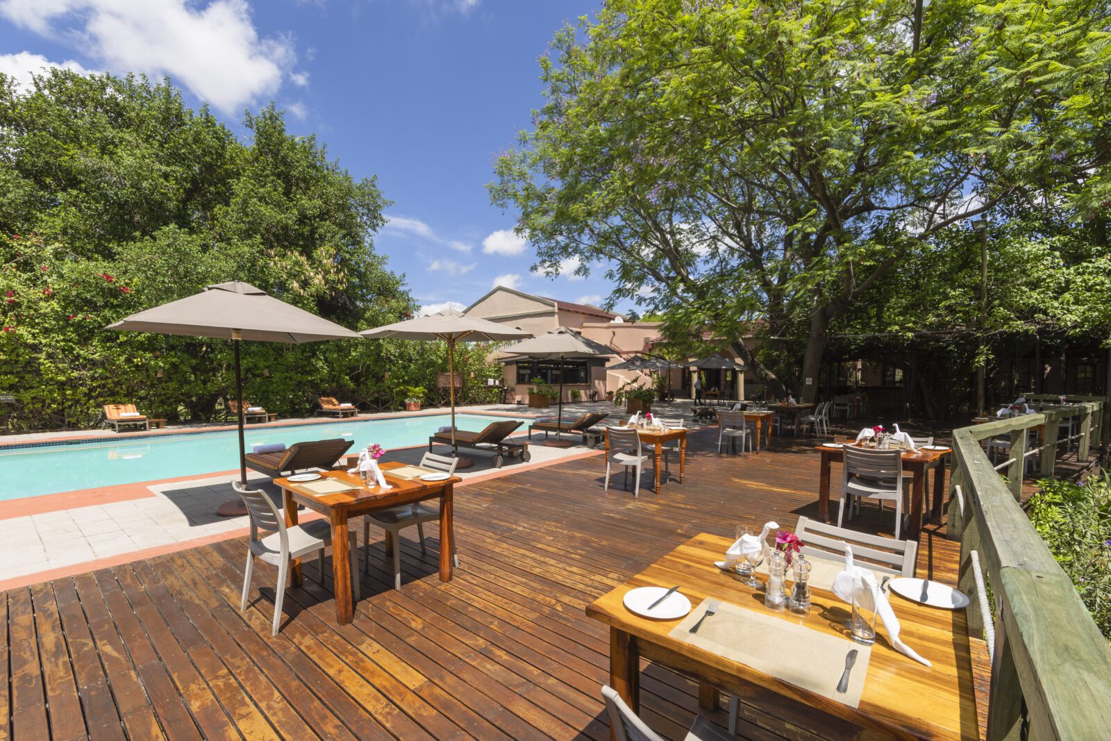 The Sedia terrace bar and restaurant tables around the pool