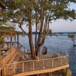 Main area deck onto the Zambezi River at Victoria Falls River Lodge.