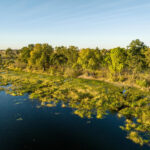Aerial view of Maxa camp which lies across a riverine forest