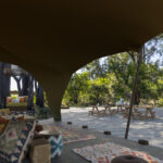 View from the lounge at Maxa, looking over the white sand courtyard to the dining area