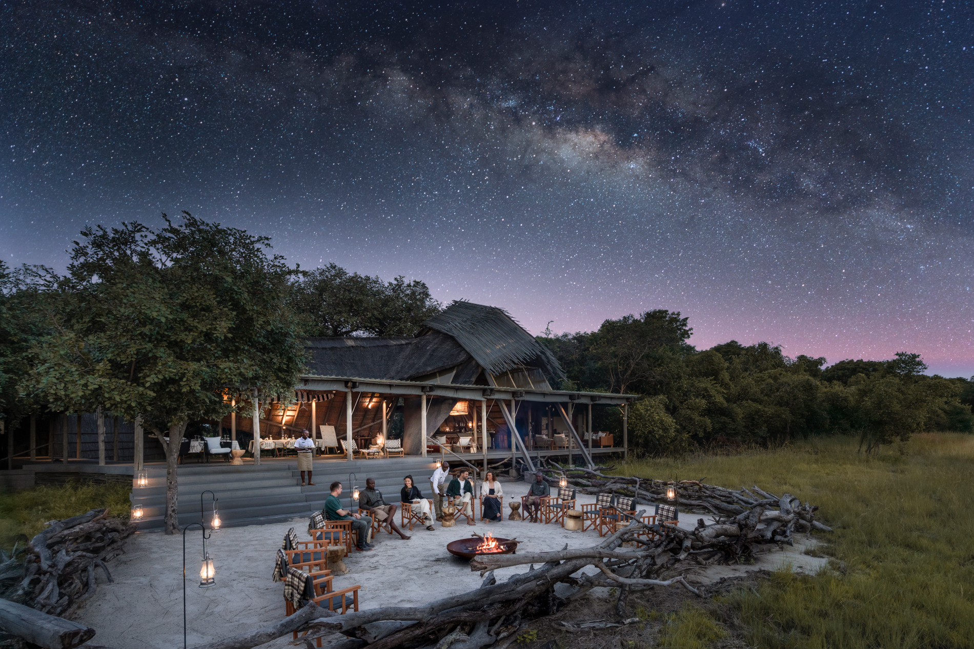 King Lewanika Lodge boma and main area illuminated under dramatic starry skies in Zambia