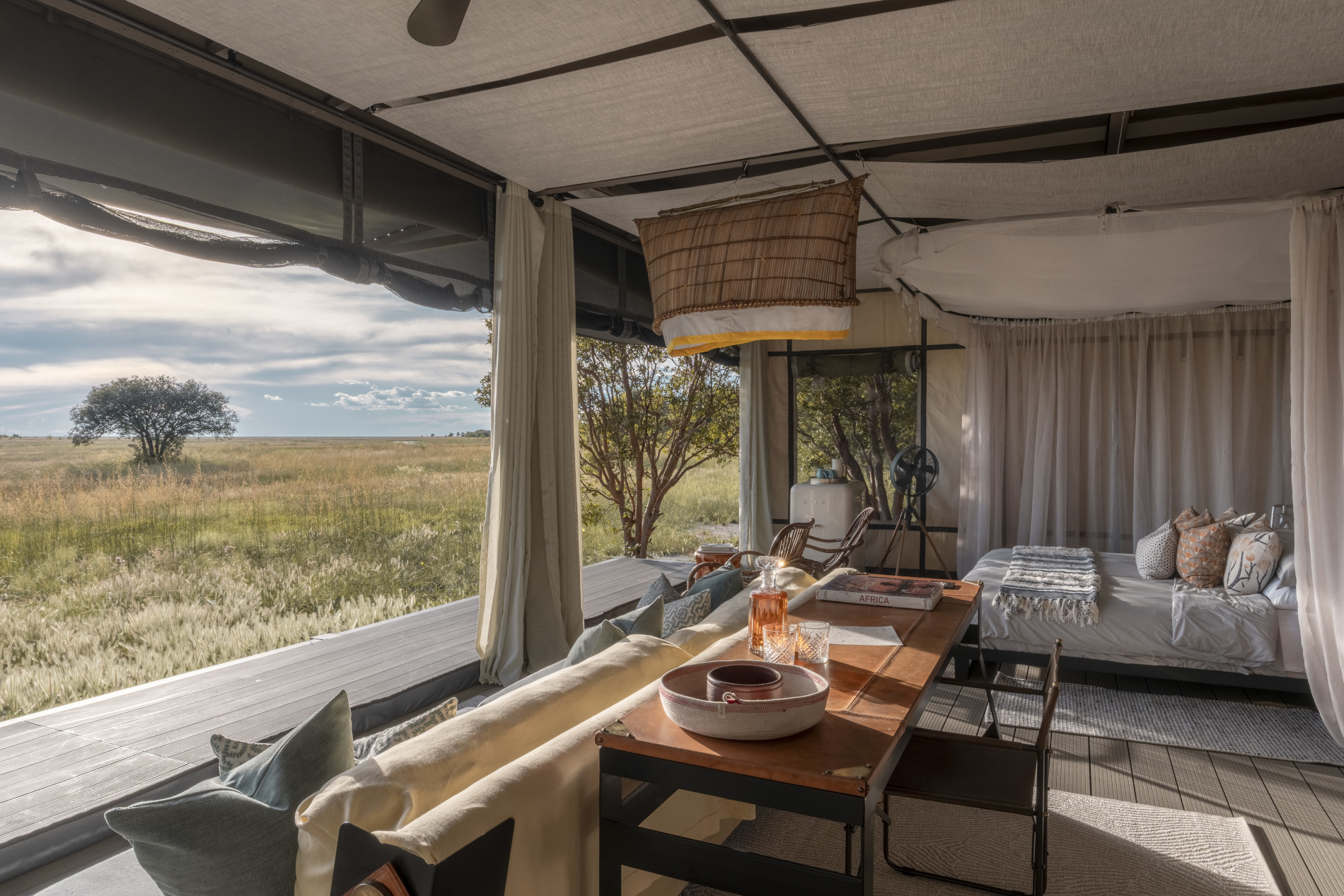 Luxurious guest room at King Lewanika Lodge with a view of Luiwa Plain