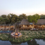 Aerial view of Sedia Sa Rona camp along the Khwai river at dusk