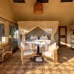 The tented rooms at Nkasa Linyanti show a simple but comfortable room with mosquito nets and room emenities