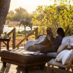 View from MmaTsebe´s main deck looking elephant drinking from the Mbudi River in Khwai