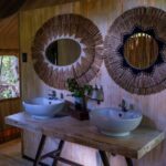 Ensuite bathrooms in shaded canvas tents at MmaTsebe.