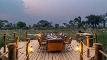 Safari dining experience overlooking water in the Okavango Delta